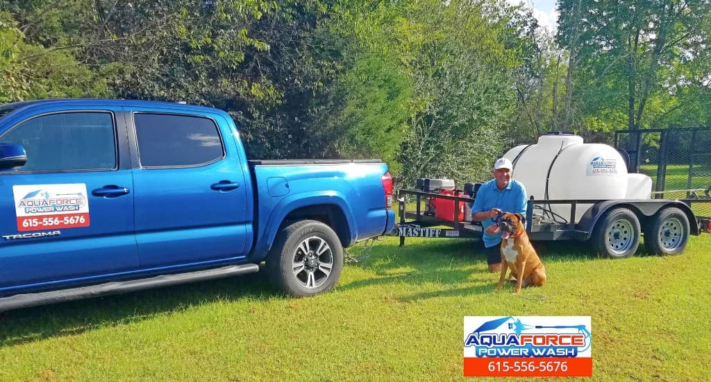 Aqua Force mobile pressure washing rig with on-board water tank and branded truck